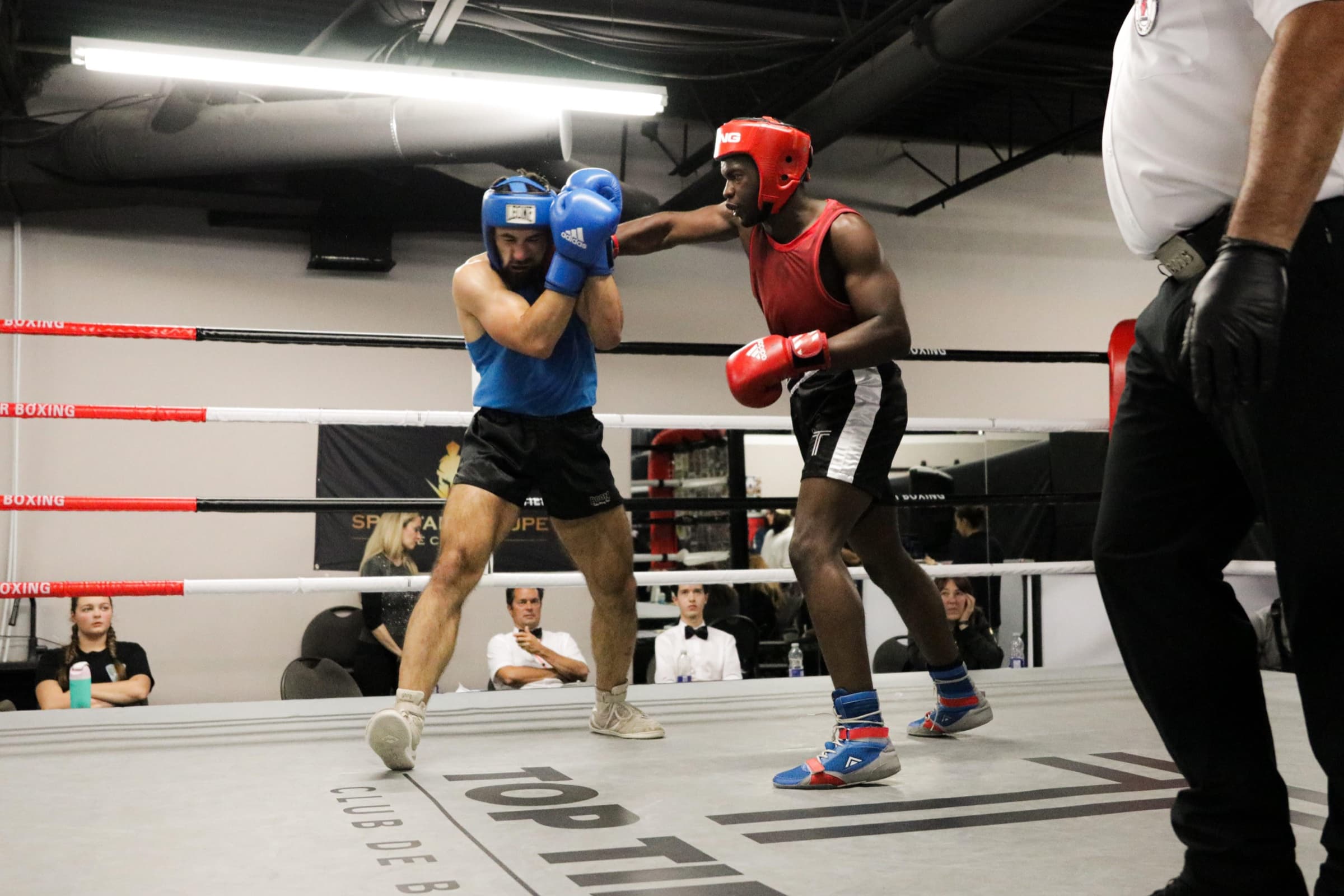 Amateur bout in the ring at Top Tier Boxing Club